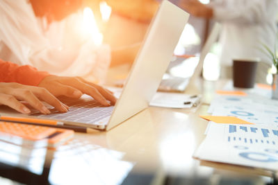 Women using laptop on table