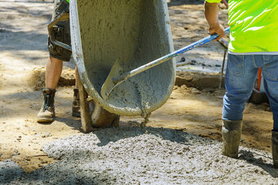 Low section of man working at construction site