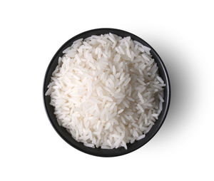 Directly above shot of rice in bowl against white background