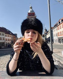 Young woman blowing bubbles