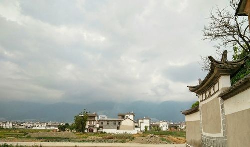 Houses and buildings against sky