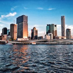 City skyline against cloudy sky