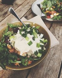 High angle view of chopped vegetables in bowl on table