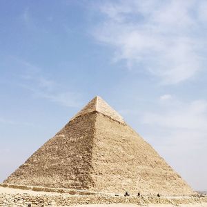 Low angle view of pyramid against blue sky