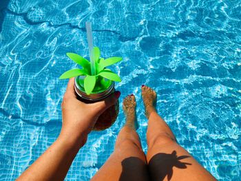 Low section of woman in swimming pool