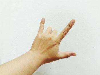 Close-up of human hand against white background