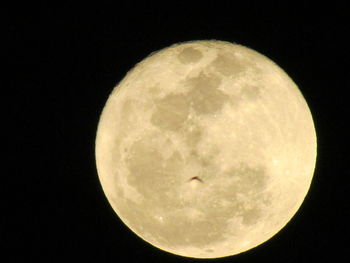 Low angle view of moon against sky at night