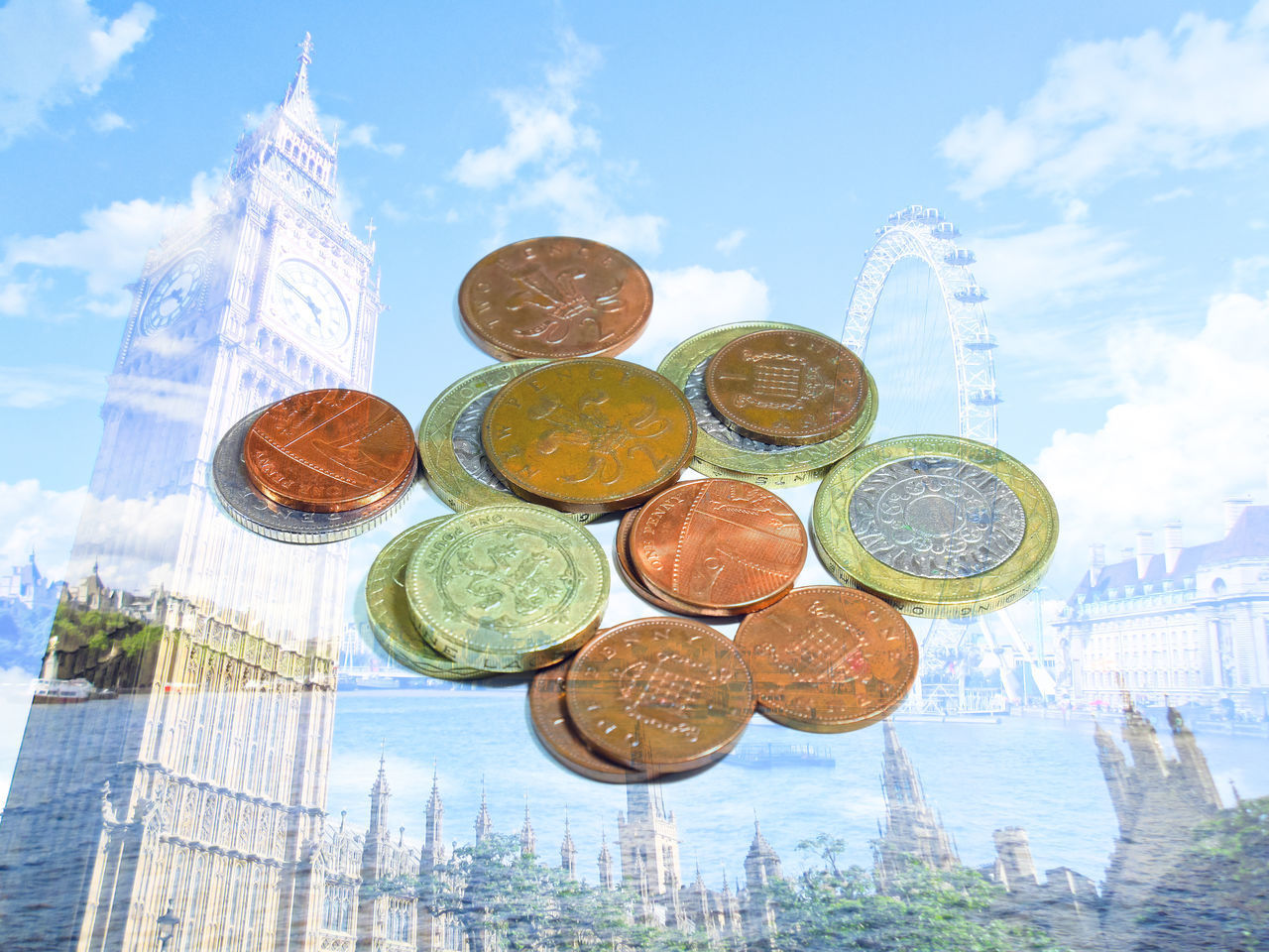 LOW ANGLE VIEW OF COINS AGAINST BUILDING