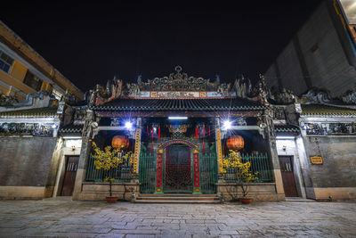 Illuminated entrance of building at night