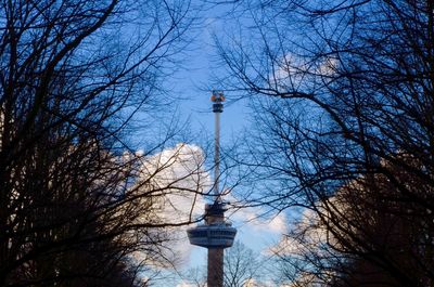 Low angle view of communications tower against sky