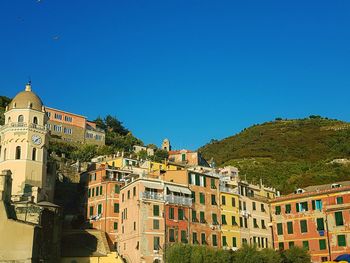 Low angle view of buildings against blue sky