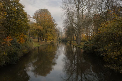 Scenic view of lake amidst trees during autumn