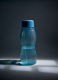 Close-up of bottle against black background