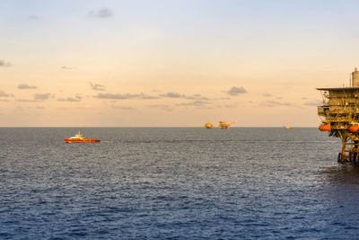 A fast crew boat leaving an oil production platform at offshore terengganu oil field