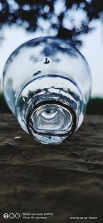 Close-up of glass bottle on table