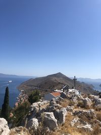 Scenic view of mountains against clear blue sky