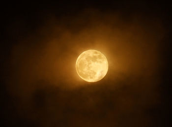 Low angle view of moon against sky at night