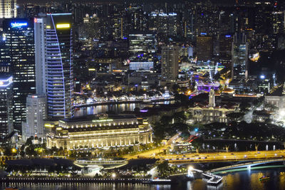 High angle view of illuminated city buildings at night