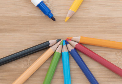 High angle view of multi colored pencils on table