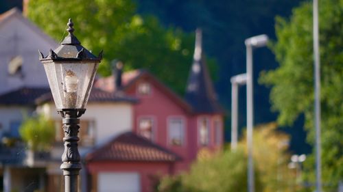 Close-up of street light against building