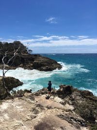 Scenic view of sea against blue sky