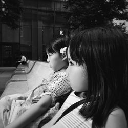 Young woman sitting on bench