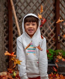 Portrait of smiling boy standing outdoors