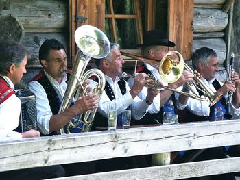 Group of people playing piano