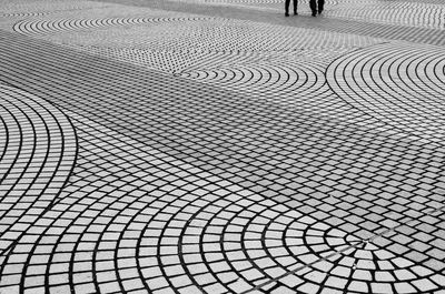 Low section of people walking on footpath