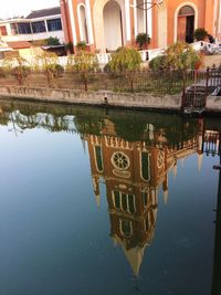 Reflection of building in puddle