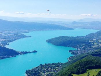 Scenic view of sea and mountains against sky