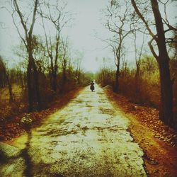 Full length of woman walking on road