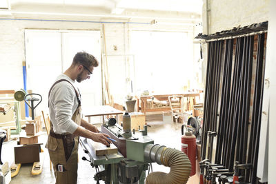 Carpenter at work in his workshop