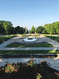 Scenic view of park against clear blue sky