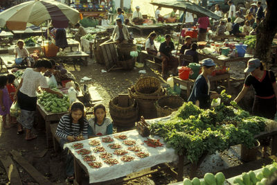 Group of people at market stall