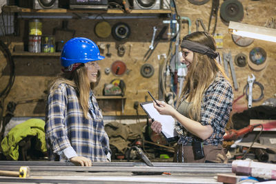 Smiling women working in workshop