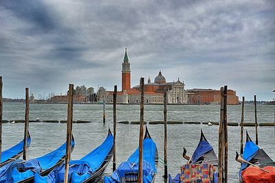 Buildings against cloudy sky