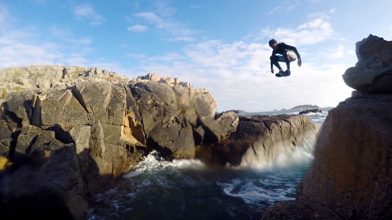 WAVES SPLASHING ON ROCKS