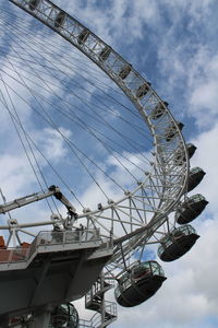 Low angle view of ferris wheel against sky