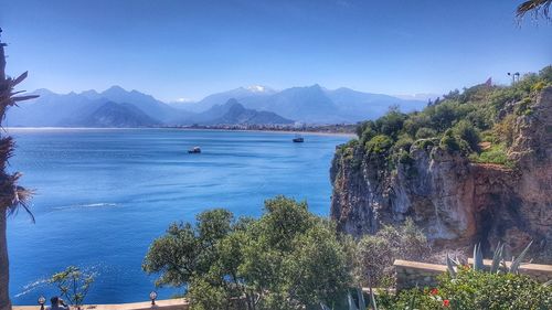 Scenic view of sea against clear blue sky