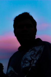 Close-up portrait of silhouette man against sky during sunset