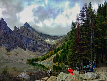 Scenic view of lake and mountains against sky