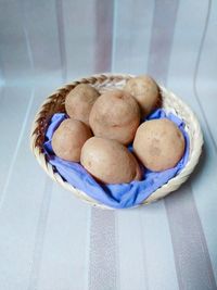 High angle view of ice cream in basket on table