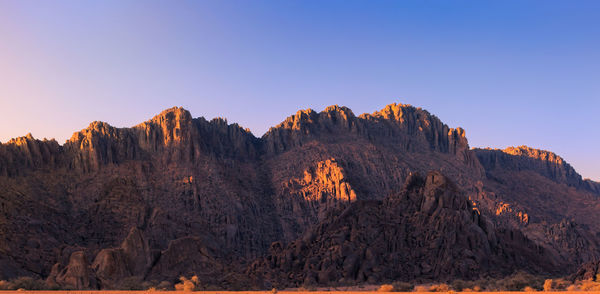 Rock formations on mountain against sky