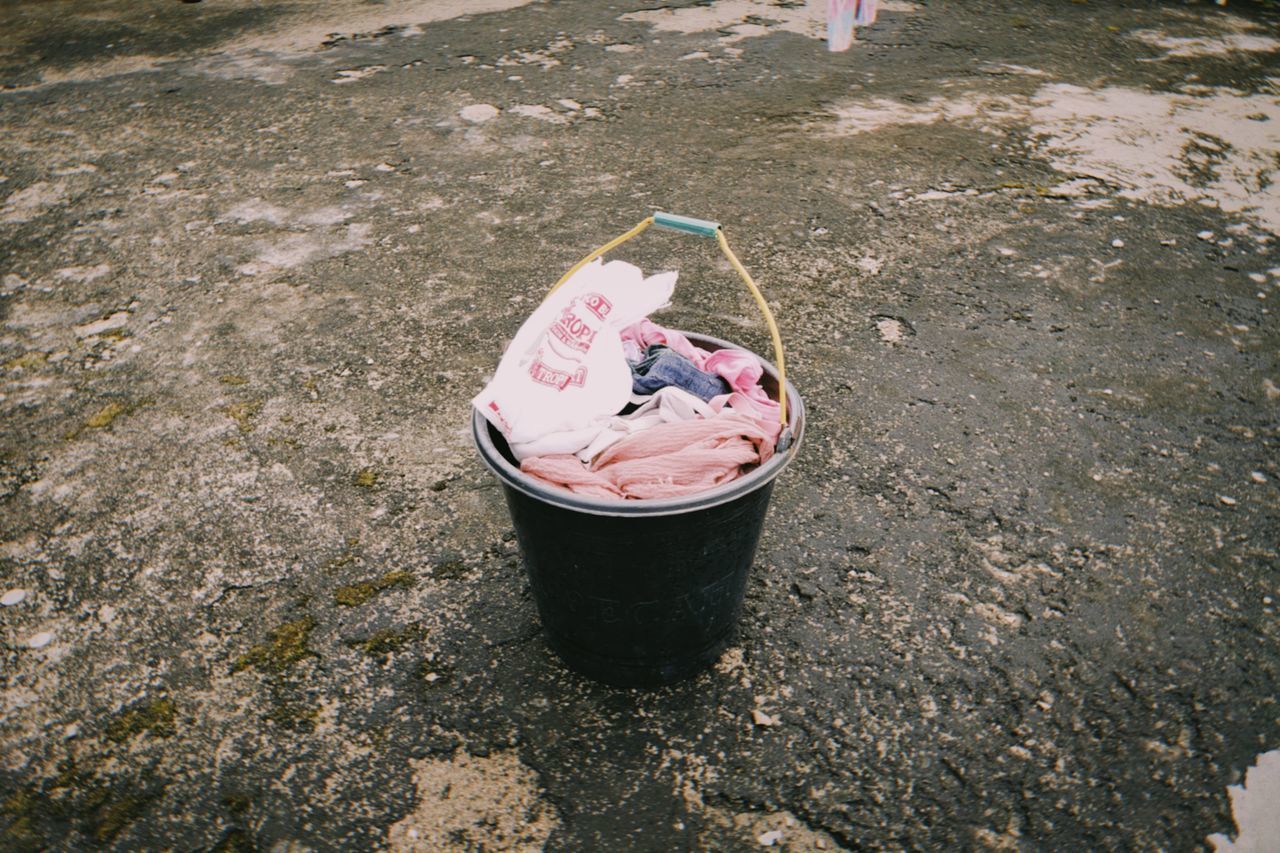 HIGH ANGLE VIEW OF ICE CREAM CONE ON FLOOR