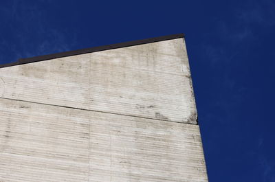 Low angle view of building against blue sky