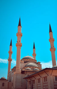 Low angle view of building against blue sky