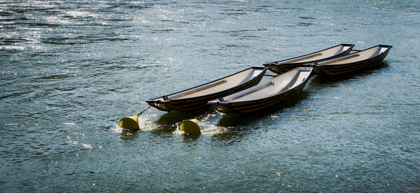 Boats moored in water