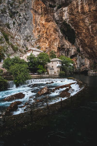 Scenic view of river flowing through rocks