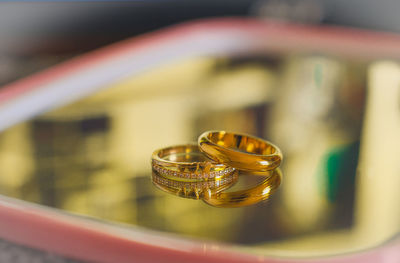 Close-up of wedding rings on metal